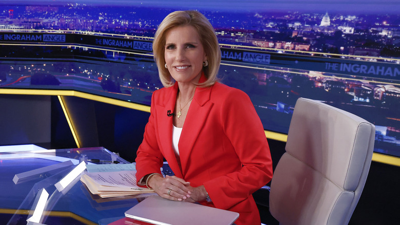 Laura Ingraham sitting behind her desk at Fox News