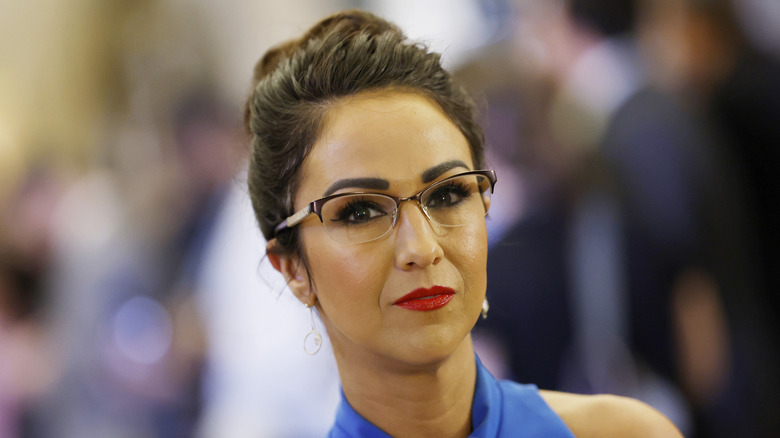 Lauren Boebert wearing a blue dress and glasses at former President Joe Biden's state of the union address.