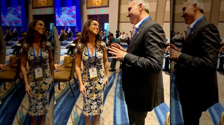 Lauren Boebert and Simon Michael Aslanpour talk after a speech on small business (2025)