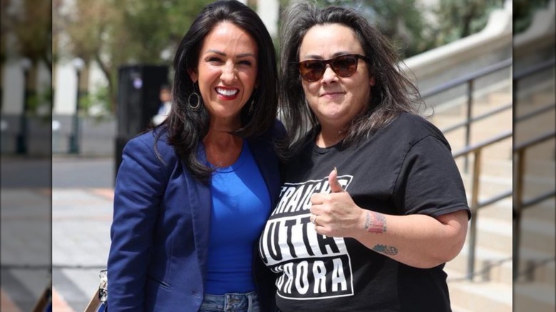 Lauren Boebert and a supporter posing outside the Colorado State Capitol Building