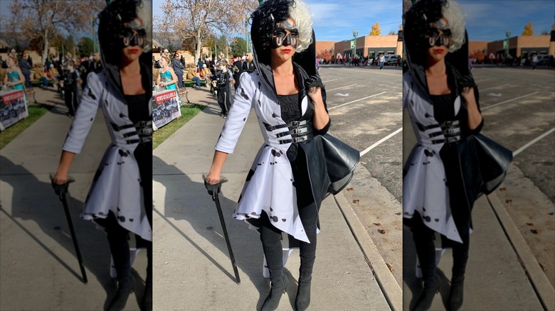 Lauren Boebert in a Cruella De Vil Halloween costume on a sidewalk.