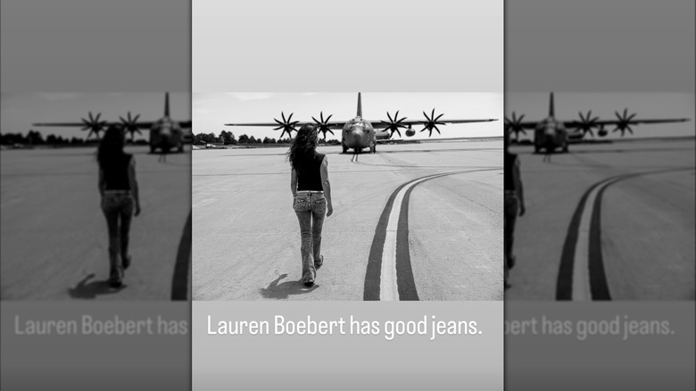 Lauren Boebert wearing a shirt and pants while walking towards a plane.