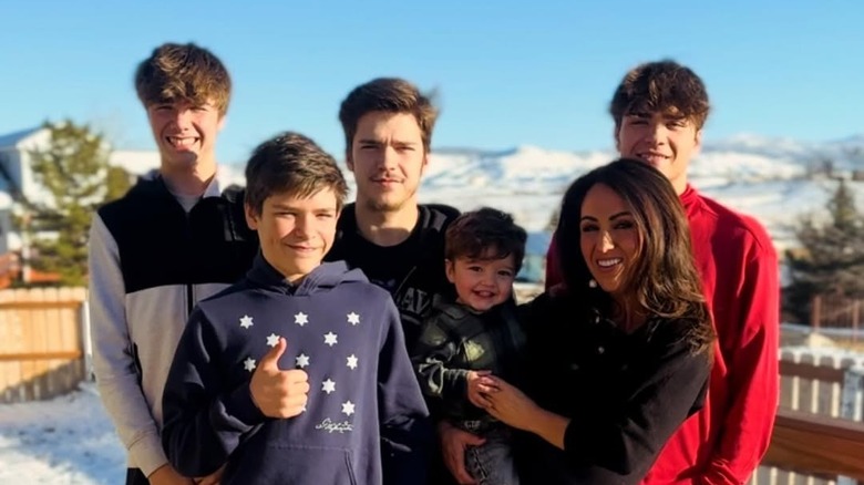 Lauren Boebert poses with her sons and grandson