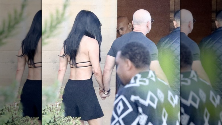 Jeff Bezos and Lauren Sanchez holding hands