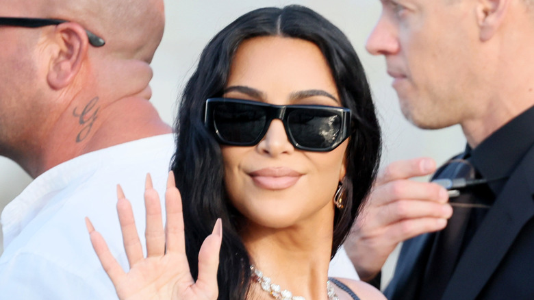 Kim Kardashian waving