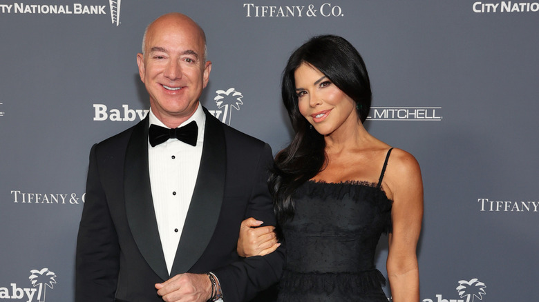 Jeff Bezos and Lauren Sánchez smiling at an event
