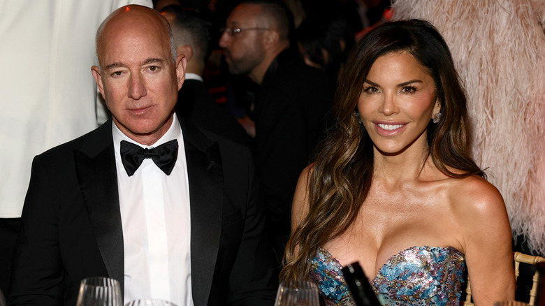 Jeff Bezos and Lauren Sanchez sitting together