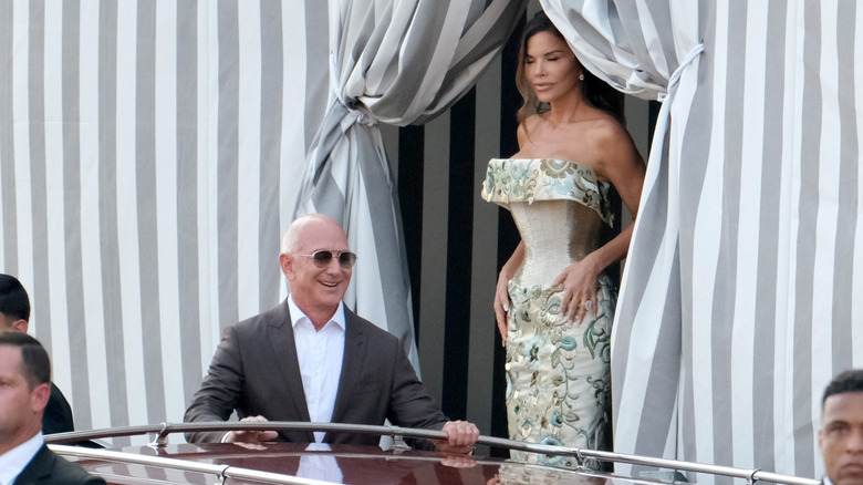 Jeff Bezos smiling next to Lauren Sanchez