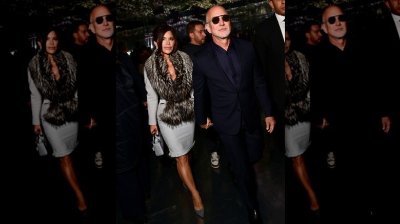 Lauren Sánchez Bezos and Jeff Bezos walking hand-in-hand