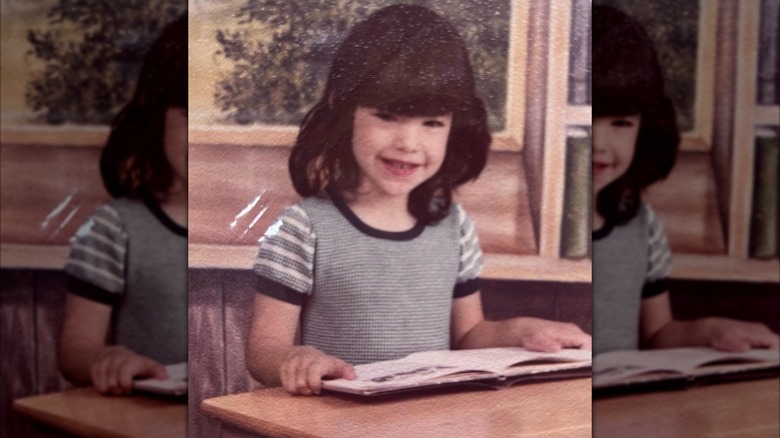 A young Lauren Sanchez sitting in a classroom