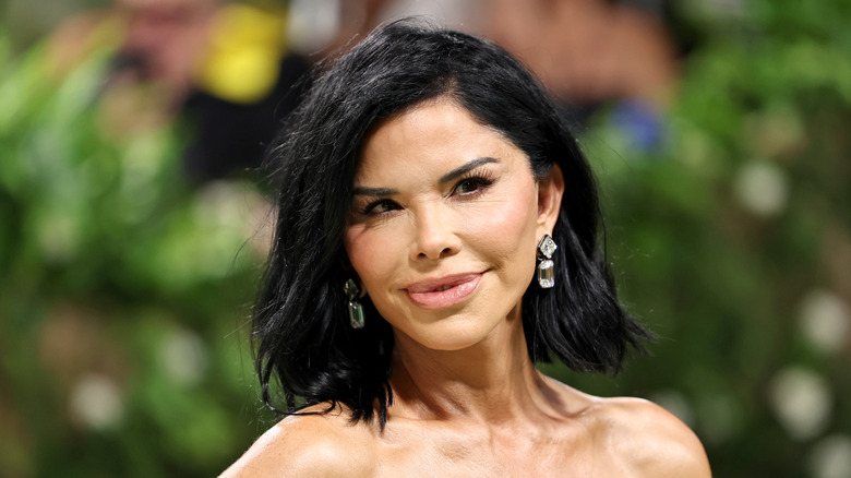 Lauren Sanchez smiling in a black dress at the 2024 Met Gala.