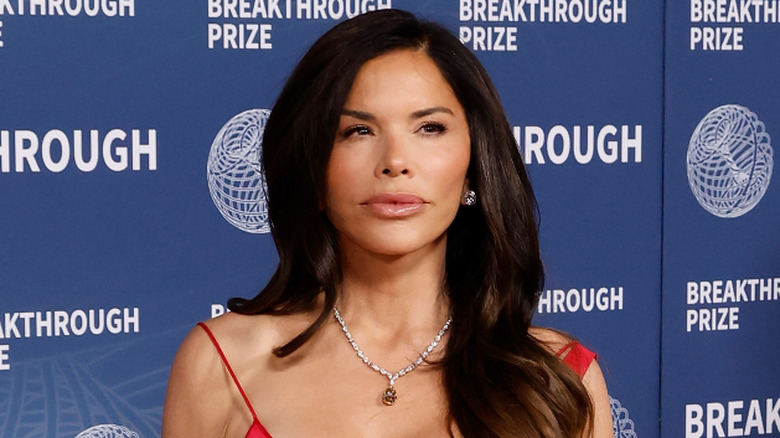 Lauren Sanchez Bezos posing in a red dress while attending the Breakthrough Prize ceremony.
