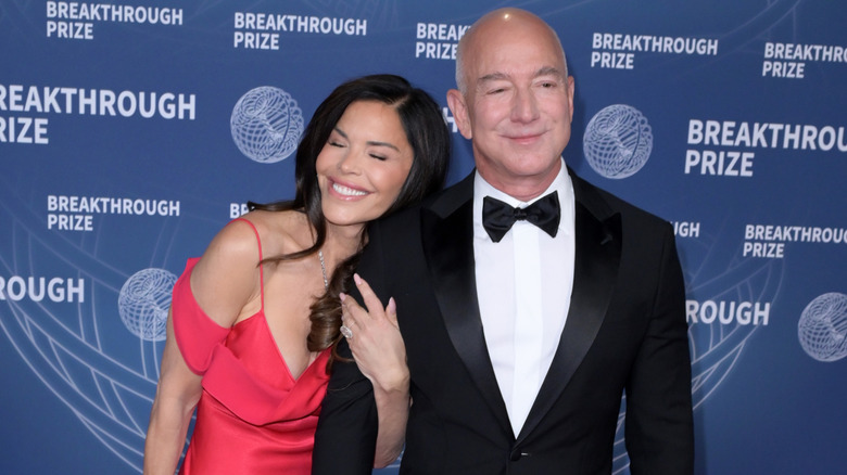 Lauren Sánchez Bezos hugs Jeff Bezos at an event