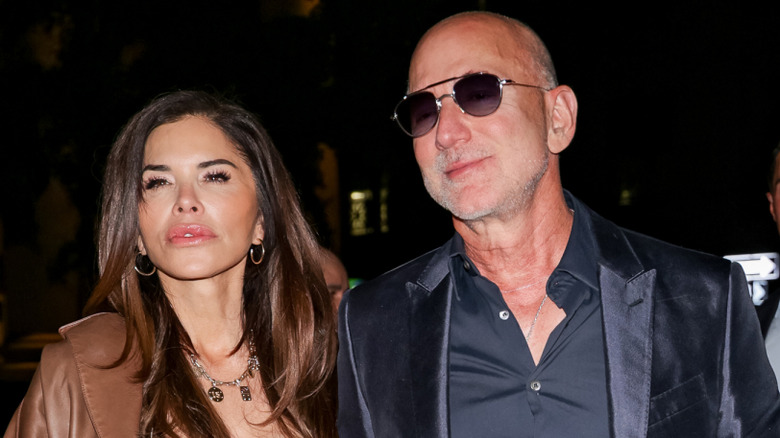 Jeff Bezos and Lauren Sanchez staring