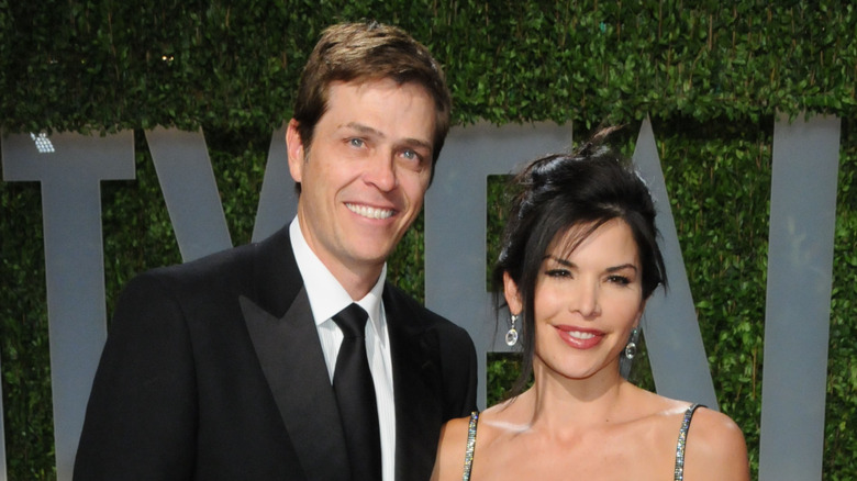 Patrick Whitesell and Lauren Sánchez smile at the 2009 Vanity Fair Oscar Party