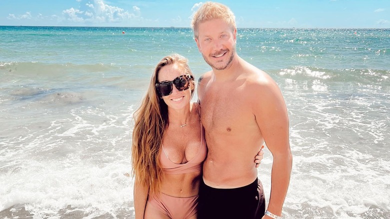 Mina and Steve Hawk posing together on a beach