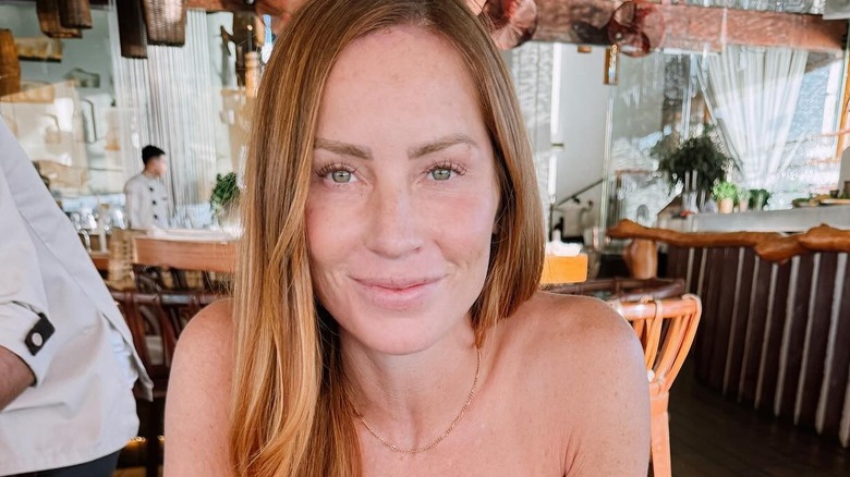 Mina Starsiak Hawk smiling at a restaurant