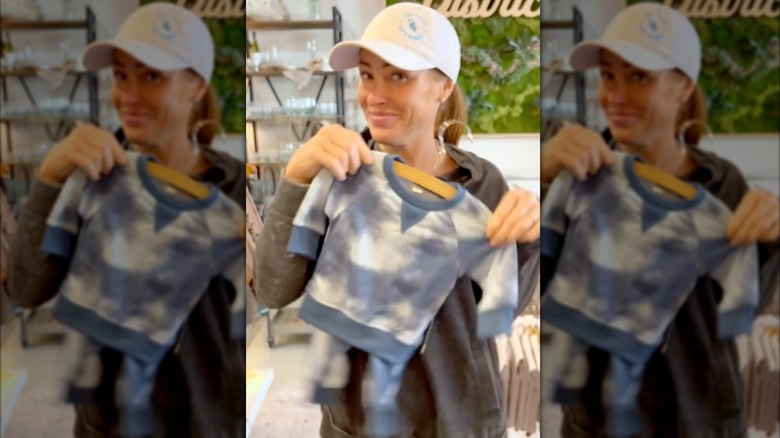 Mina Starsiak Hawk displaying outfit from Jack and Drew clothing line