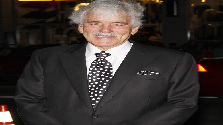 Dennis Farina wearing a polka dot tie