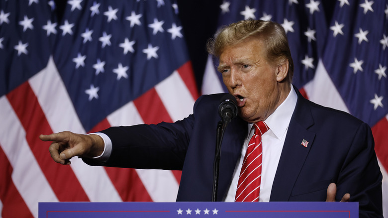 Donald trump shouting and pointing at podium