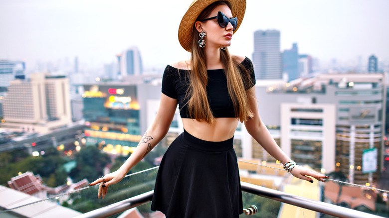 woman wearing skirt on balcony