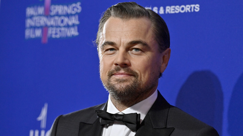 Leonardo DiCaprio smiling in a tuxedo
