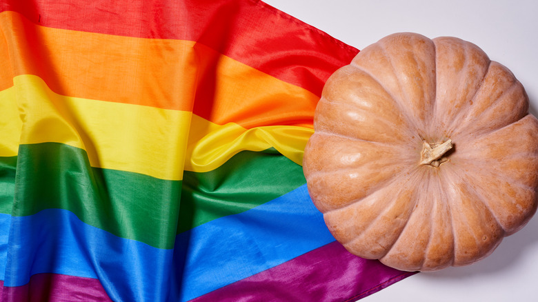 Pumpkin atop a rainbow flag