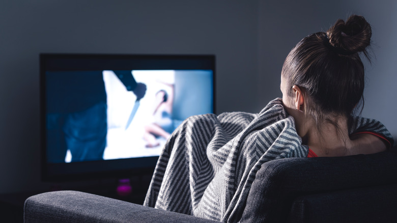 Girl watching a horror movie