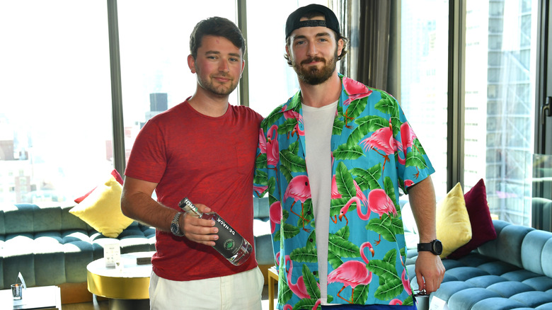 Adam Millman and Daniel Neeson showing off De Nada Tequila