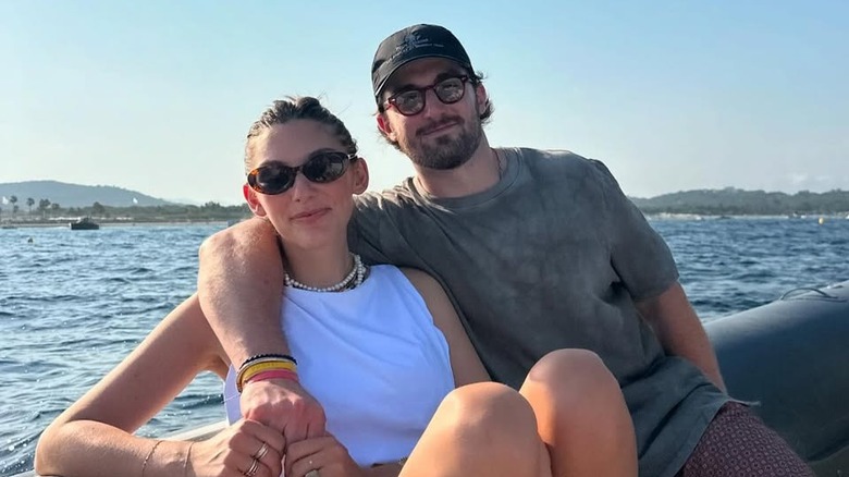 Dianel and Natalie Ackerman posing on a sailboat