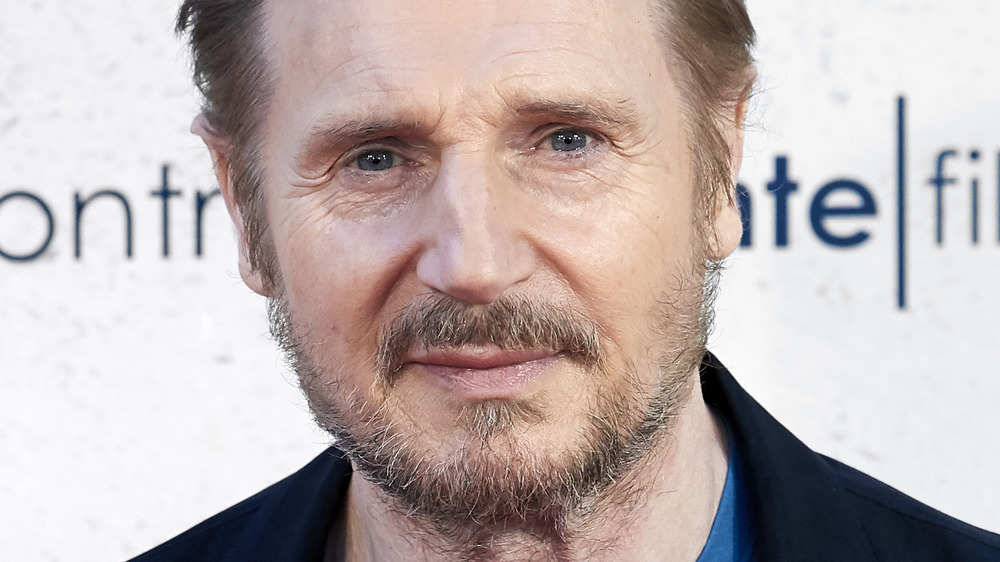 Liam Neeson on a red carpet 