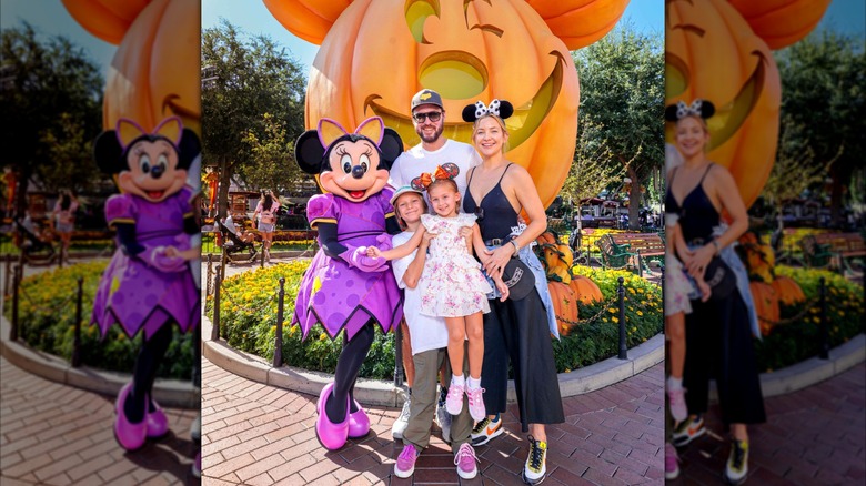 Kate Hudson, Danny Fujikawa, and kids smile with Minnie Mouse