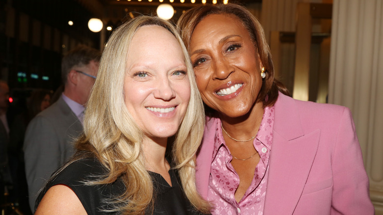 Amber Laign and wife Robin Roberts pose at the opening night of the new play "Left on Tenth" on Broadway at The James Earl Jones Theater on October 23, 2024 in New York City.
