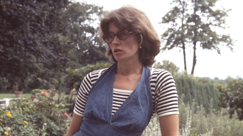 Young Martha Stewart posing in sunglasses