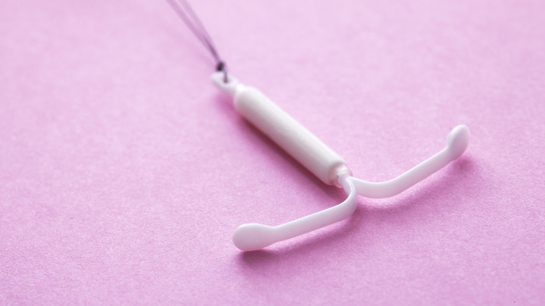 IUD on a purple background 