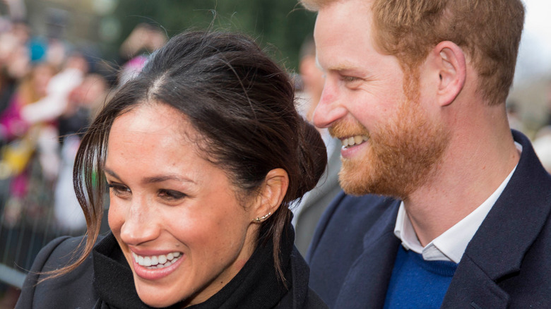 Meghan Markle standing with Prince Harry