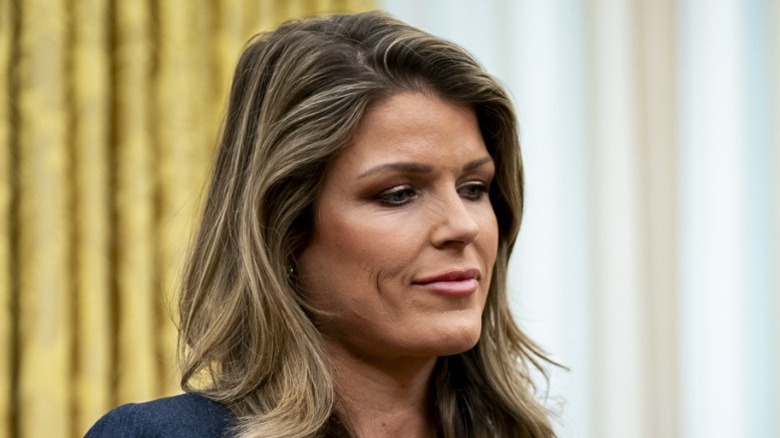 Lindsey Halligan holds papers to be signed in the Oval Office of the White House (2025)