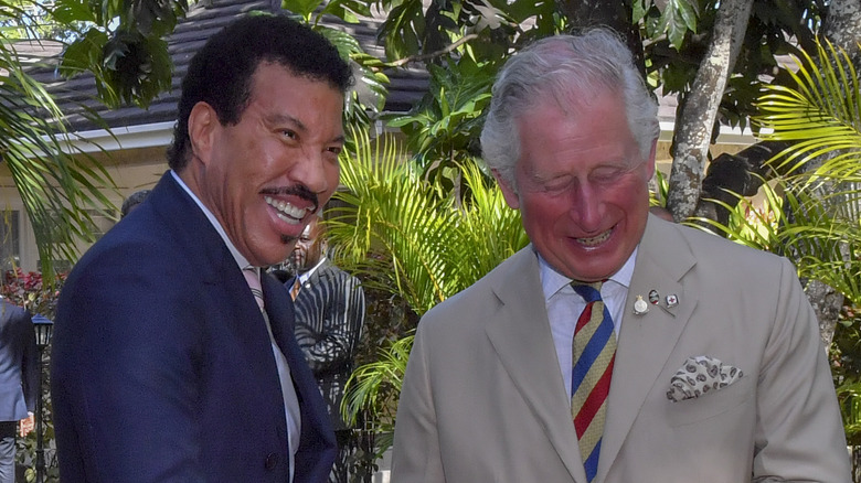 Lionel Richie and King Charles laughing 