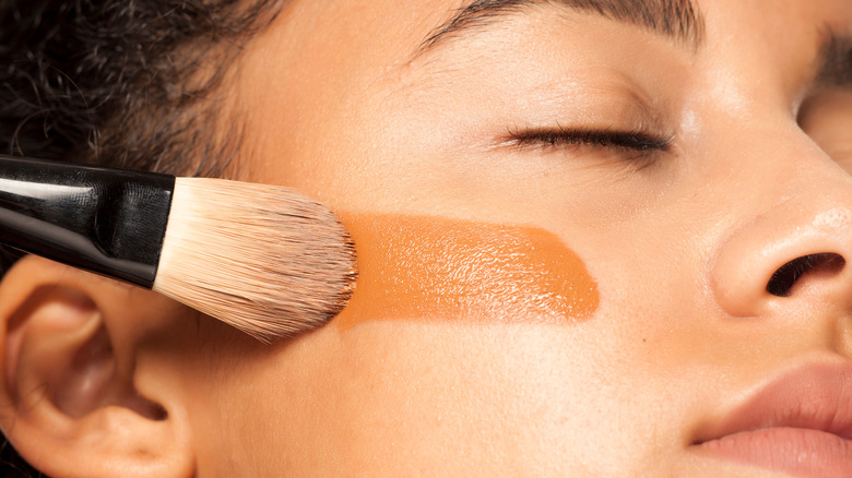 Liquid foundation applied with brush