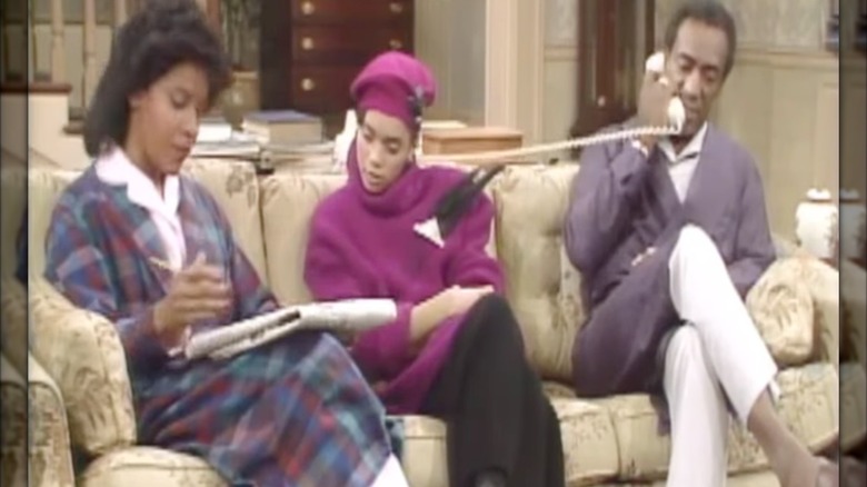 Lisa Bonet as Denise Huxtable on "The Cosby Show" sitting between Phylicia Rashad and Bill Cosby as Clair and Cliff Huxtable