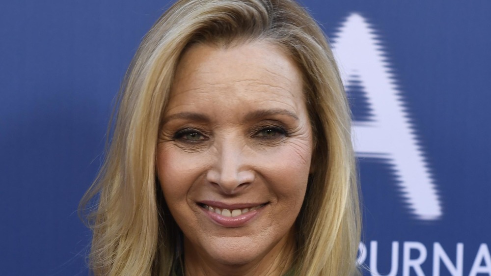 Lisa Kudrow smiles at event