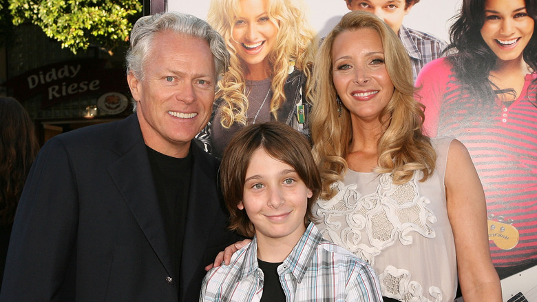 Julian Stern with parents, smiling