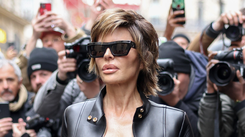 Lisa Rinna posing in black sunglasses