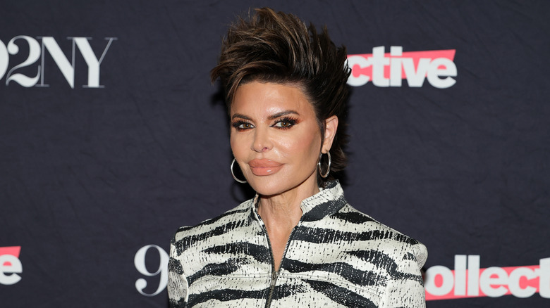 Lisa Rinna posing in zebra print outfit