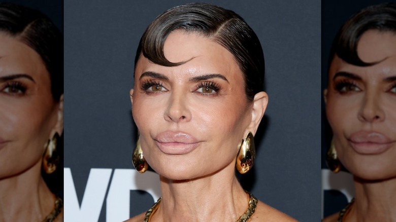 Lisa Rinna close up, statement bang, yellow dress