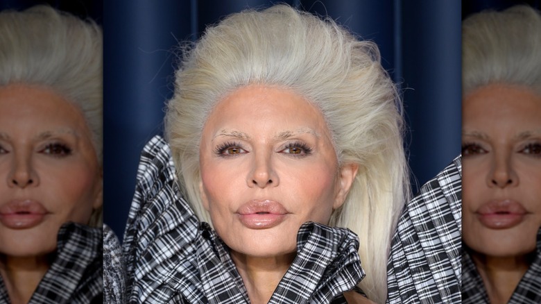 Lisa Rinna blonde wig, black and white checkered top statement bow