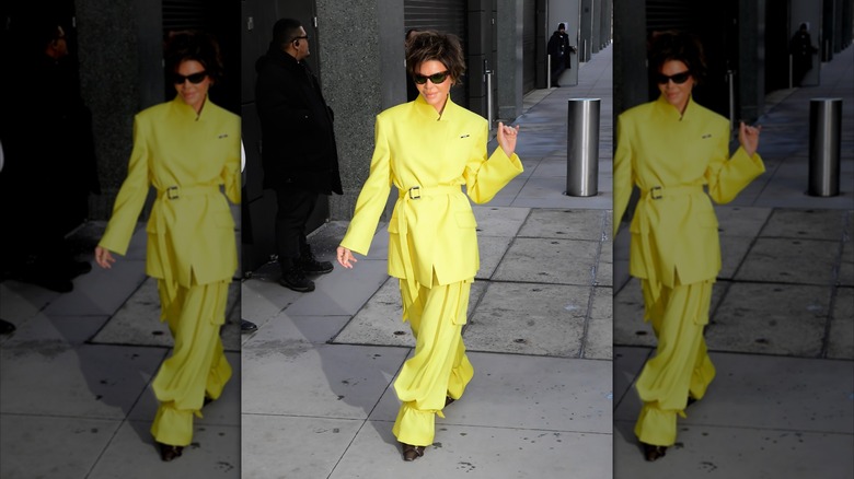 Lisa Rinna in a yellow pant suit on a New York street