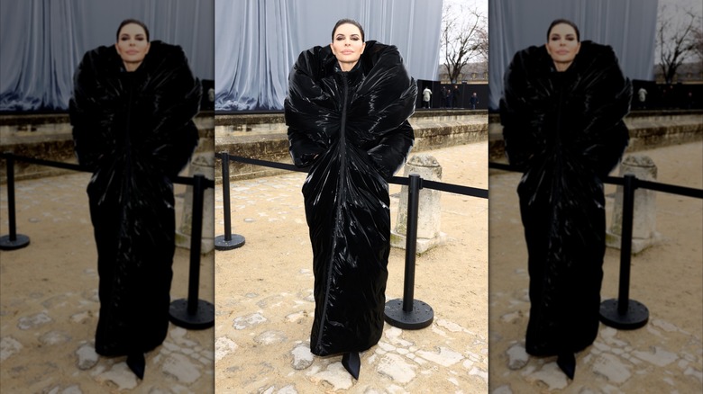 Lisa Rinna in an oversized black jacket at a fashion show