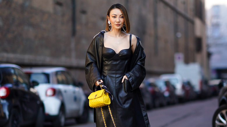 Woman carrying yellow bag