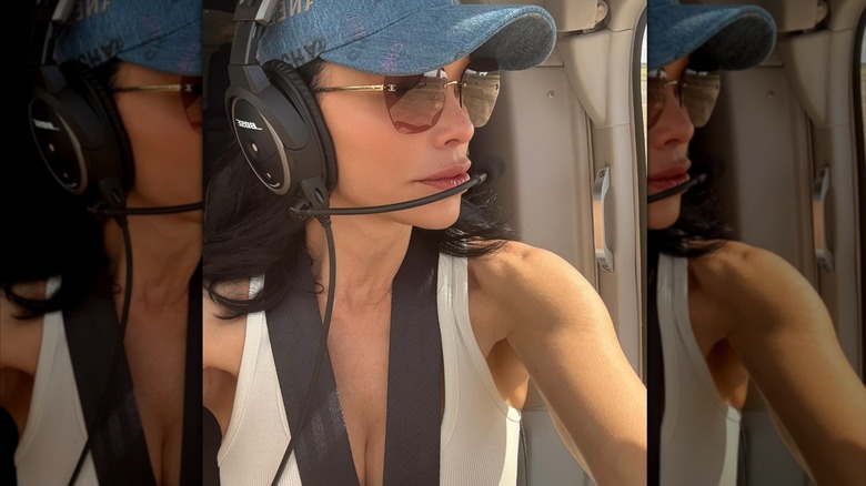 Lauren Sanchez wearing headphones and mic